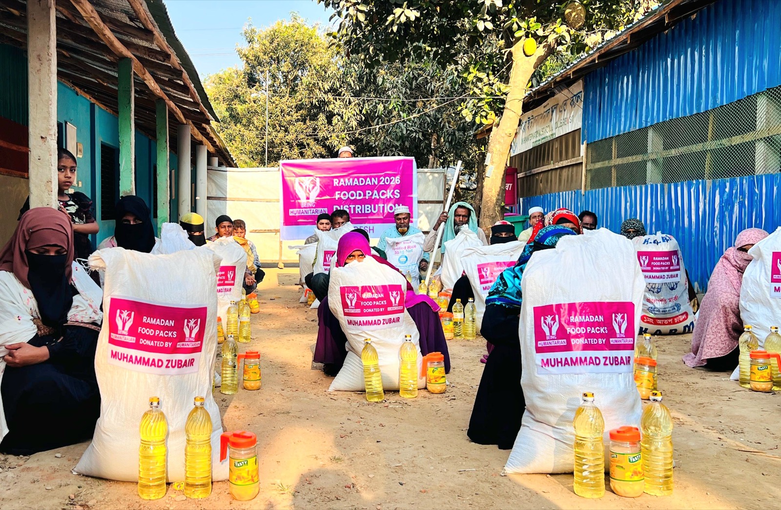 Being Humanitarian volunteers delivering Ramadan food packs